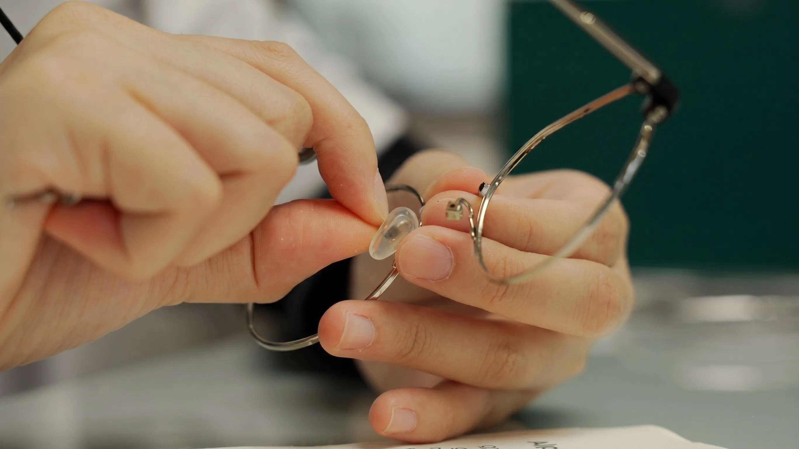 Optometrist working on spectacle frame cleaning and restoration