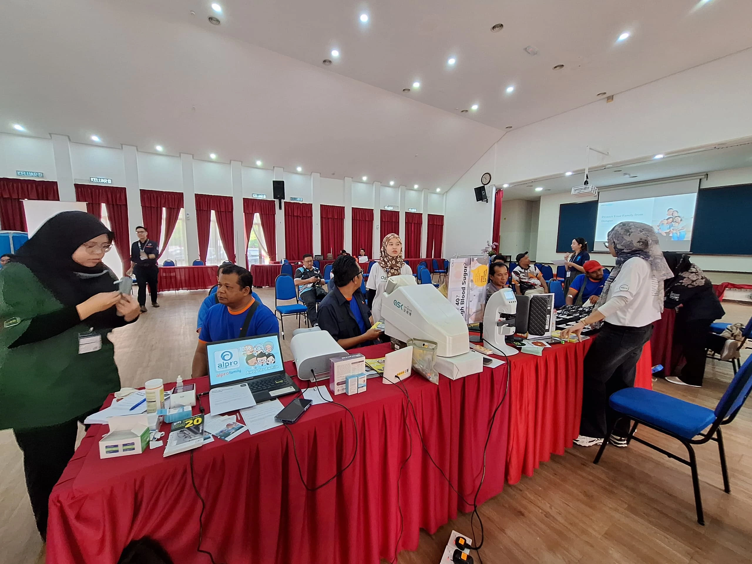 Wide-angle view of OptiSaver’s eye health awareness booth at SAINS Health Screening Event in Malaysia.